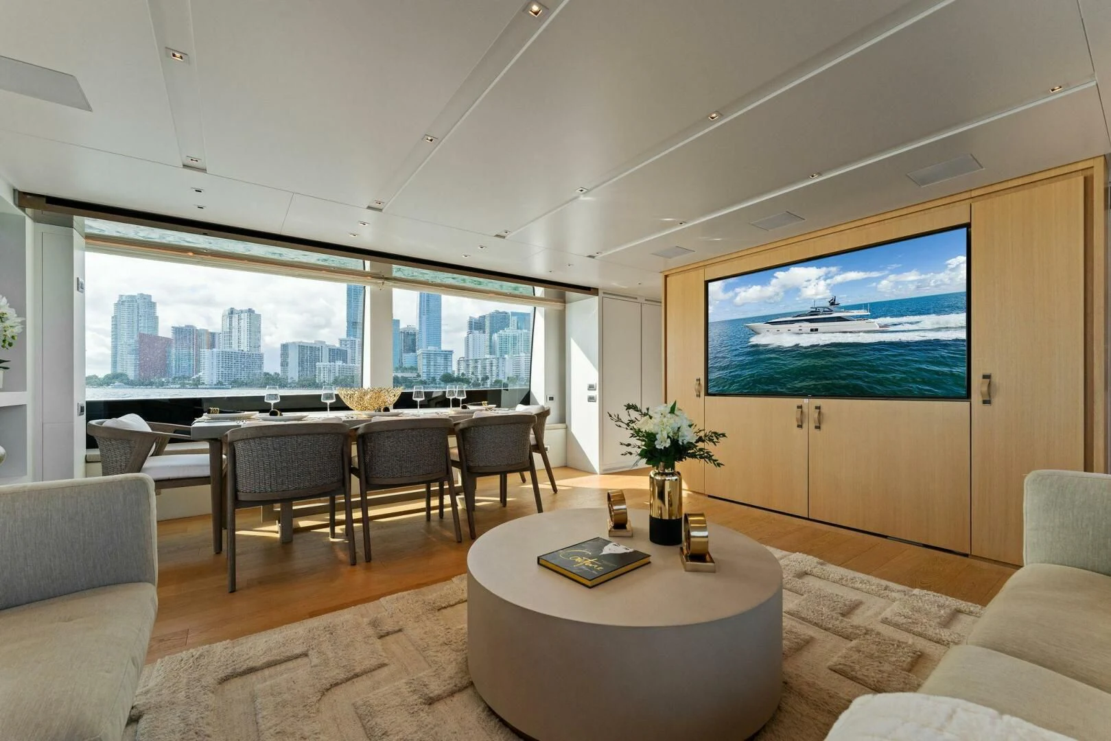 a living room with a large window aboard GATSBY Yacht for Charter