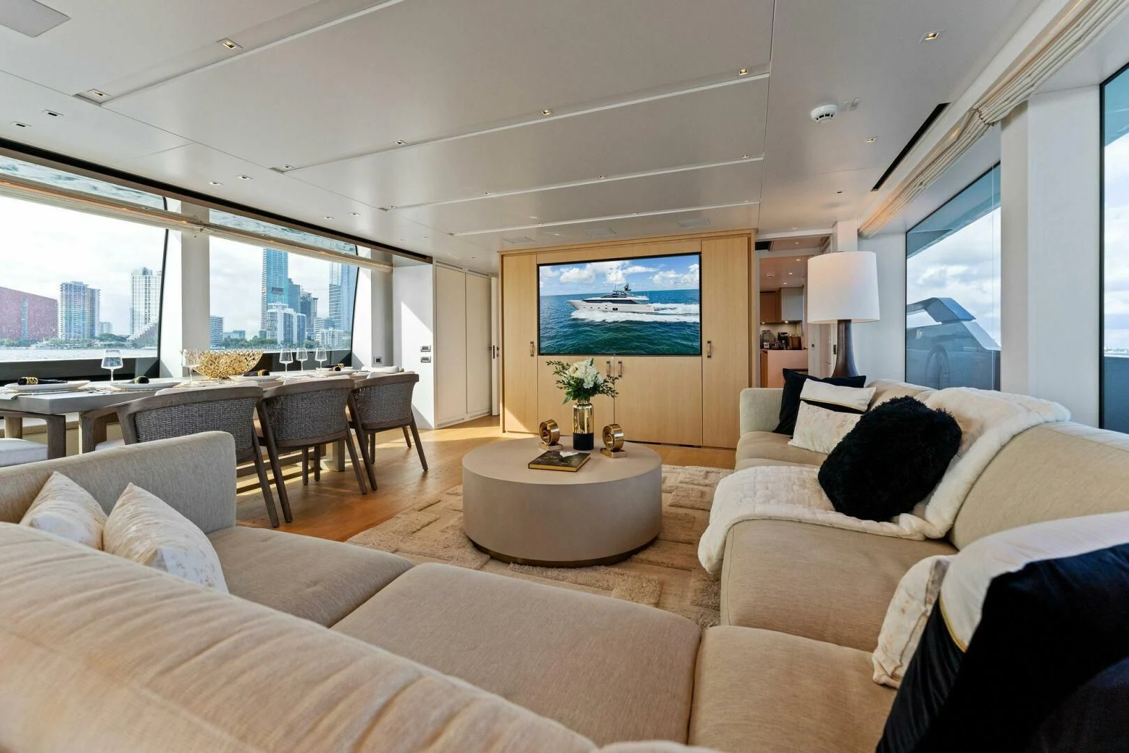 a living room with a large window aboard GATSBY Yacht for Charter