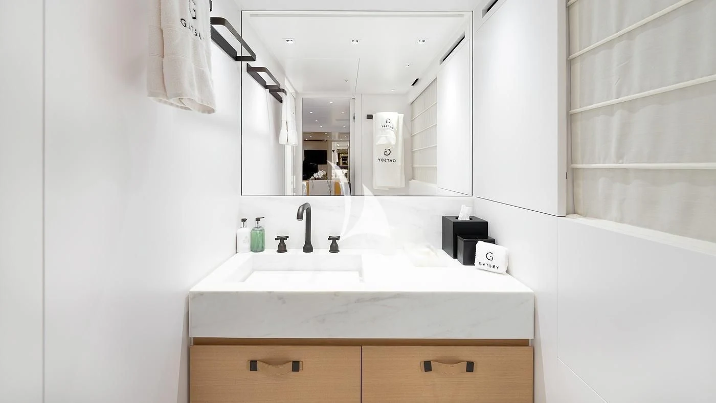 a bathroom with a sink and mirror aboard GATSBY Yacht for Charter