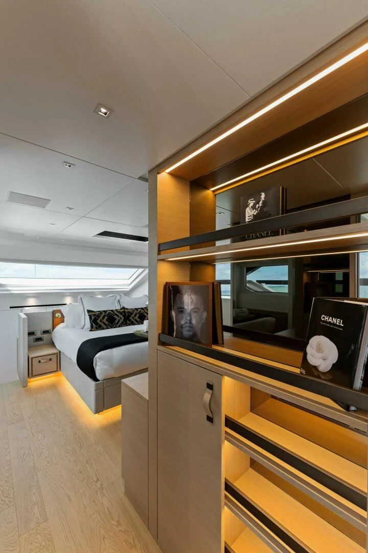 a room with a bed and a mirror aboard GATSBY Yacht for Charter