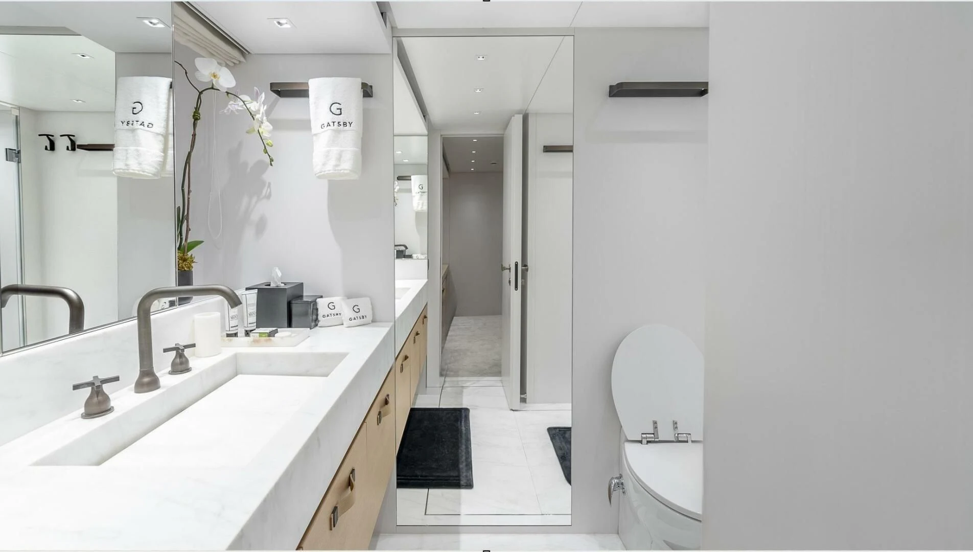 a bathroom with a sink and a toilet aboard GATSBY Yacht for Charter