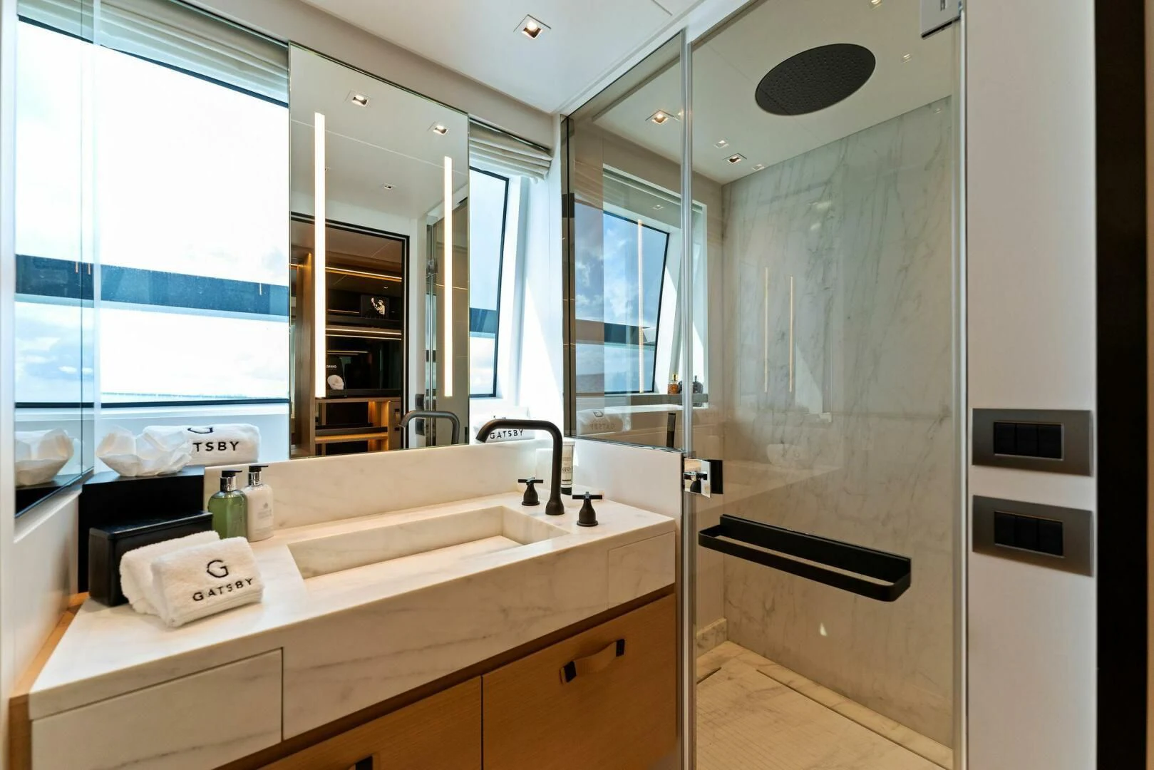 a bathroom with a large mirror aboard GATSBY Yacht for Charter