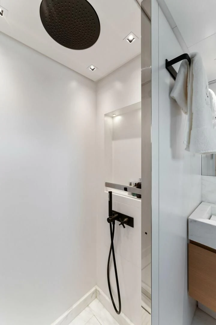 a bathroom with a sink and a mirror aboard GATSBY Yacht for Charter