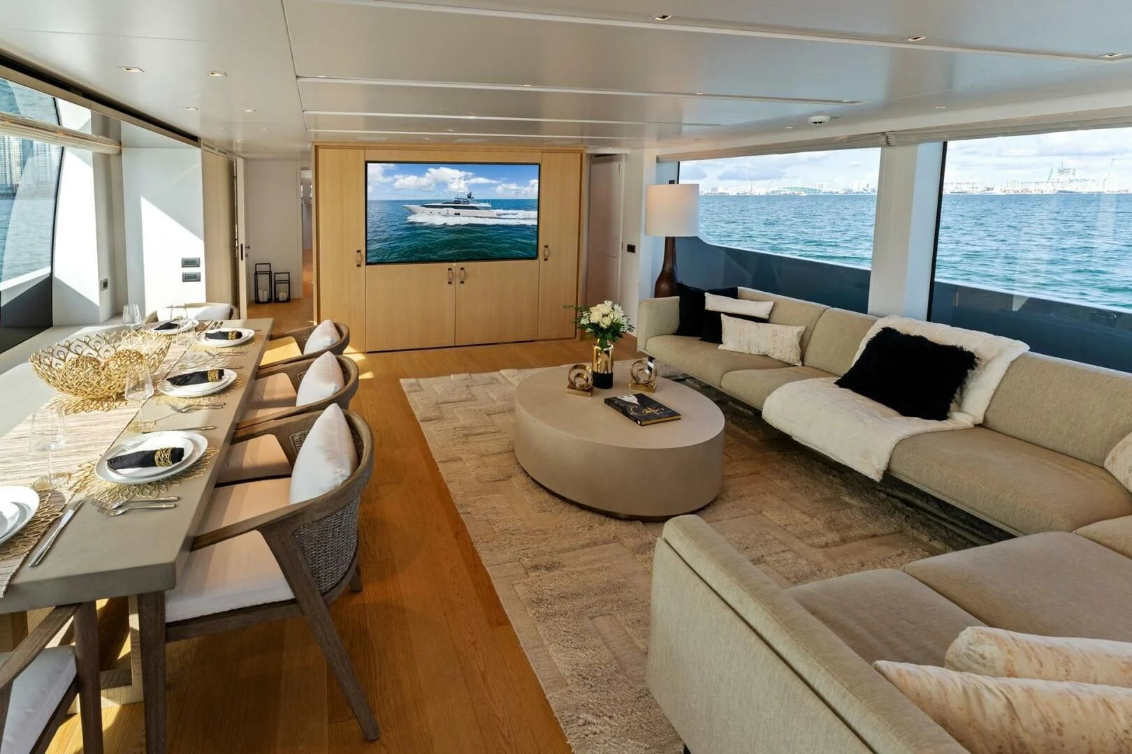 a living room with a large window aboard GATSBY Yacht for Charter