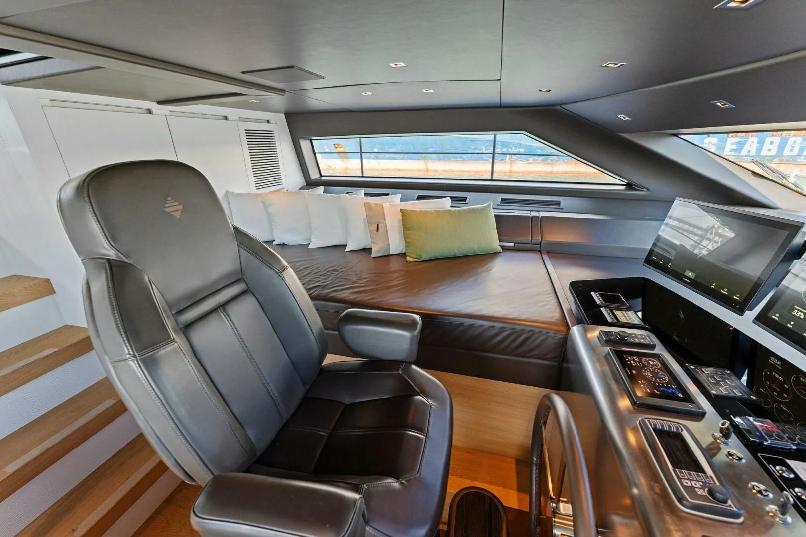 a room with a couch and a television aboard GATSBY Yacht for Charter