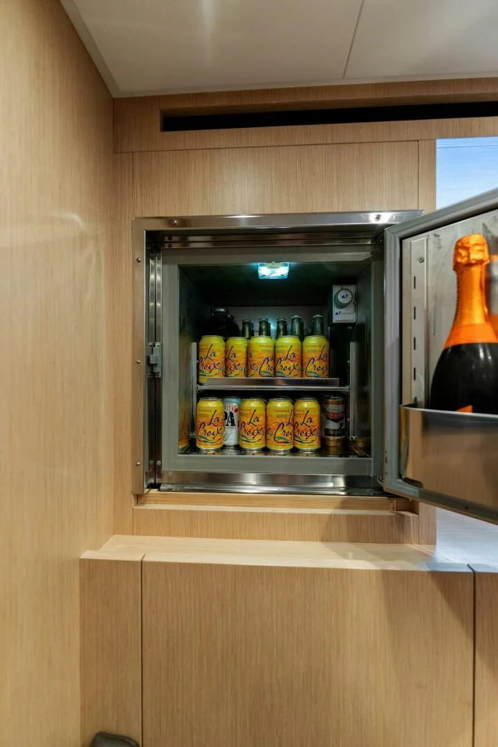 a refrigerator with a lot of food in it aboard GATSBY Yacht for Charter