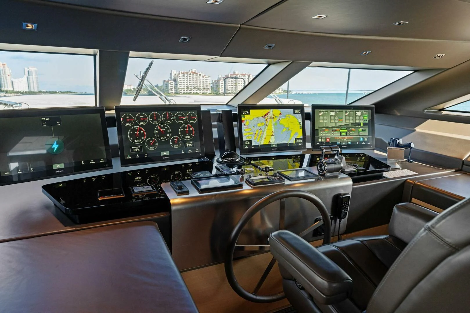 a control room with multiple monitors aboard GATSBY Yacht for Charter