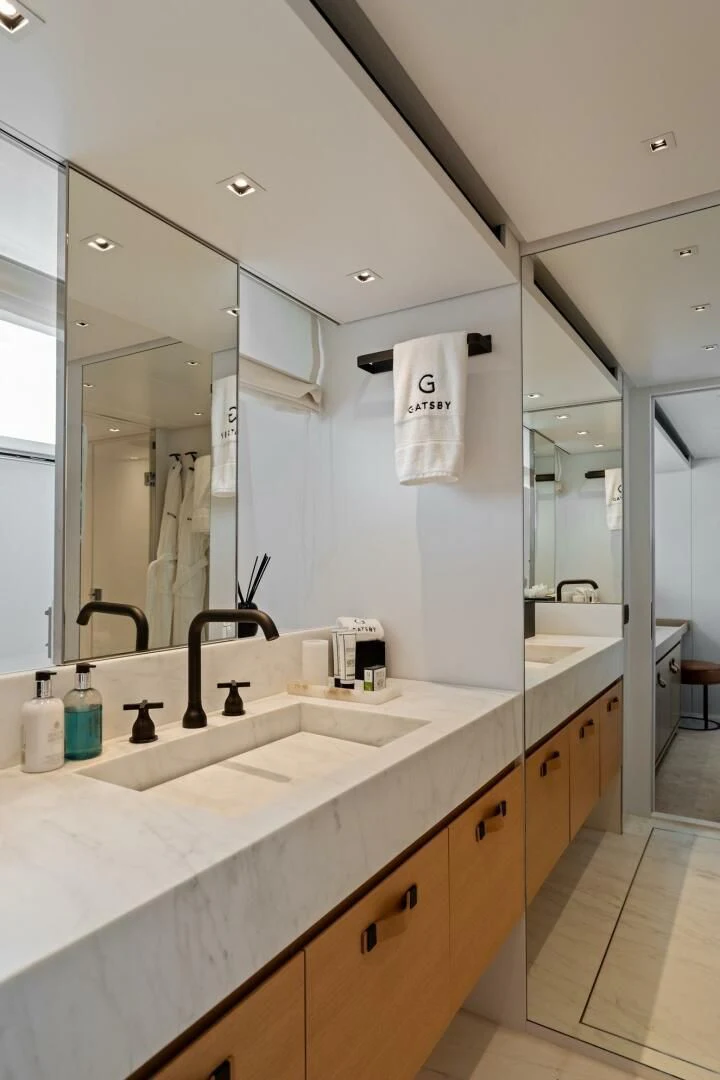 a bathroom with a large mirror aboard GATSBY Yacht for Charter