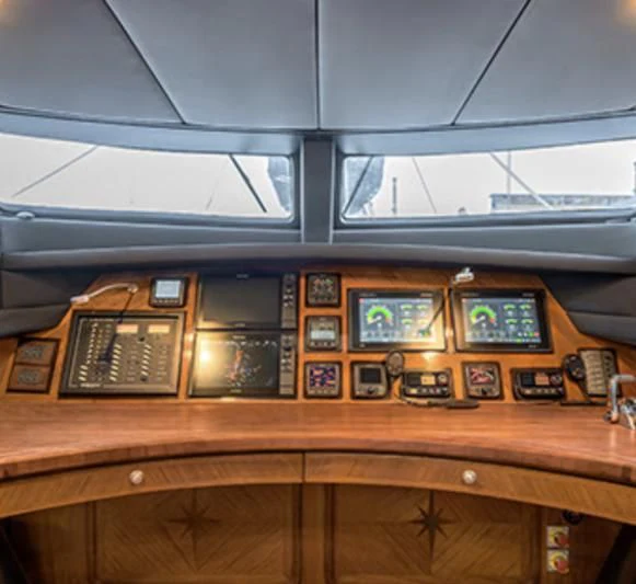 a group of electronic devices on a table aboard PANGAEA Yacht for Sale