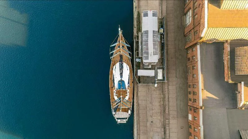 a clock tower in a city aboard PANGAEA Yacht for Sale