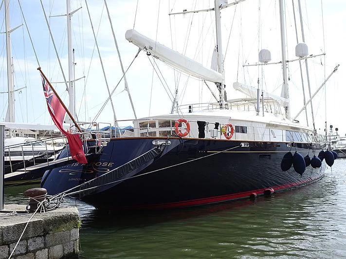 a boat docked at a pier aboard IS A ROSE Yacht for Sale