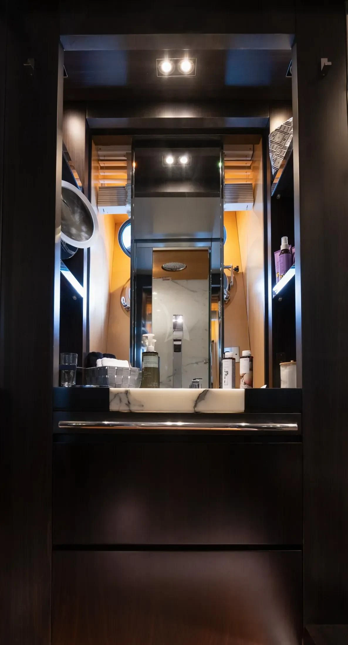 a mirror showing a person in a room with a lot of objects aboard MAC Yacht for Sale