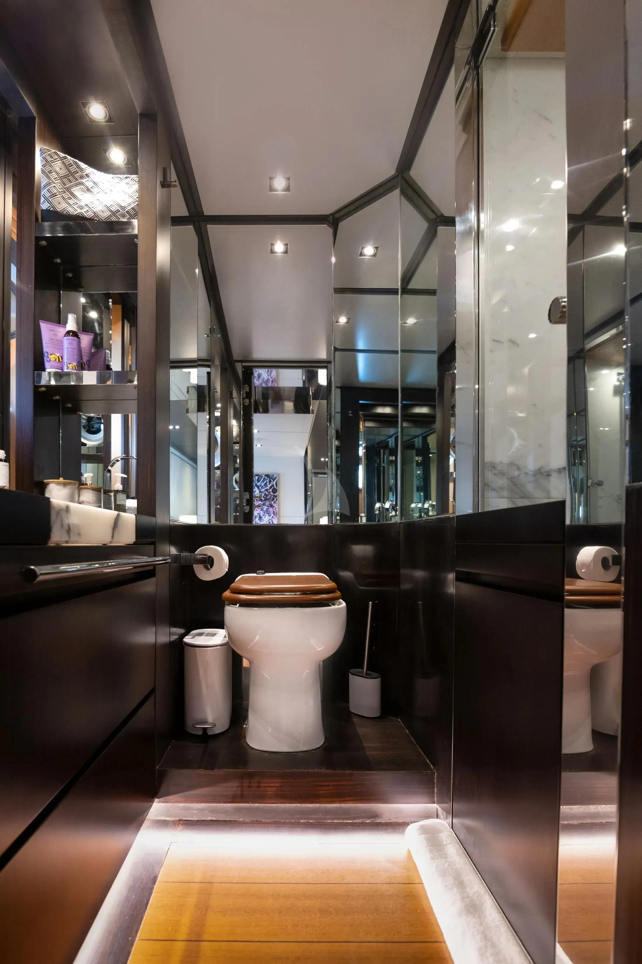 a bathroom with a glass shower aboard MAC Yacht for Sale
