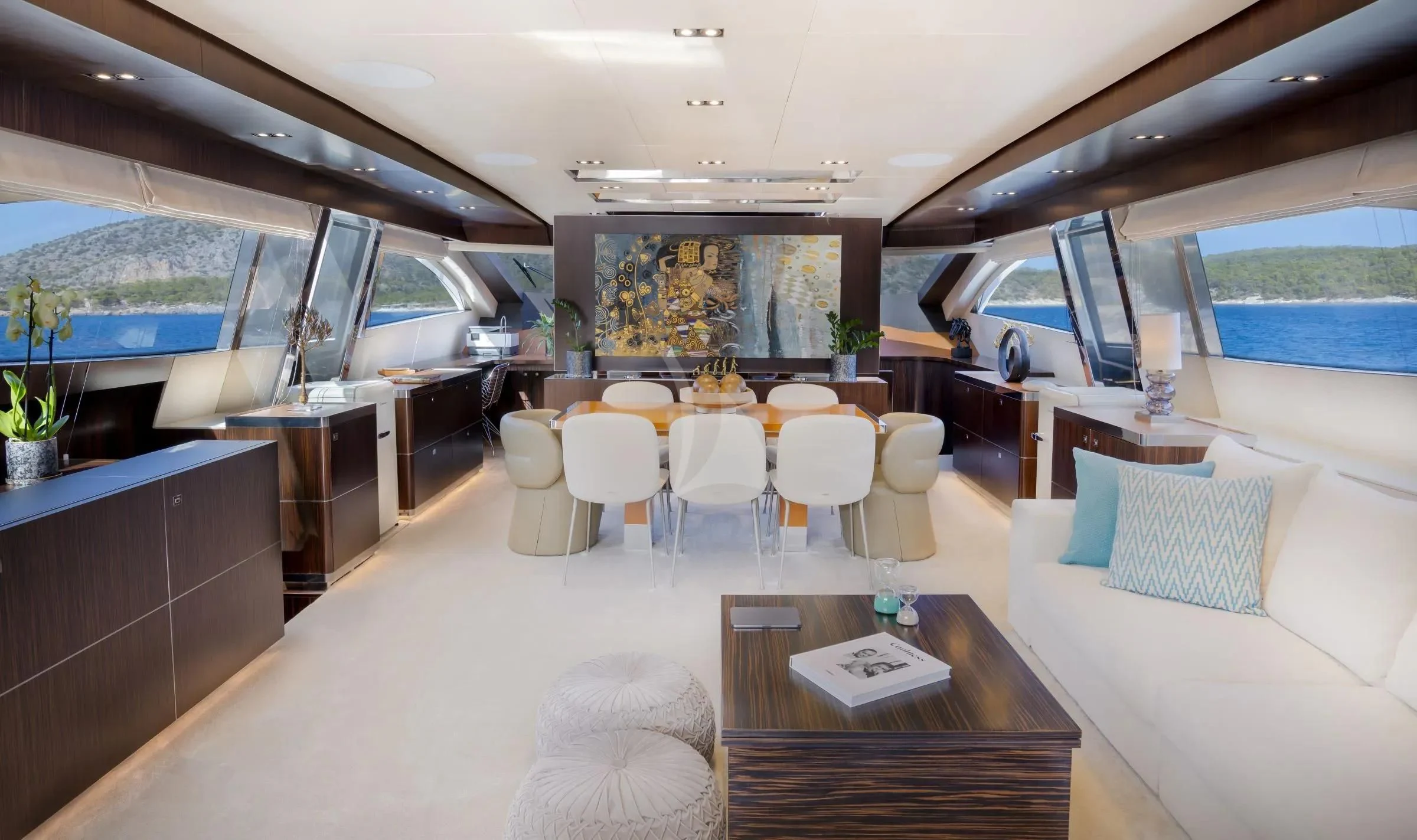 a room with a table chairs and a large window aboard MAC Yacht for Sale
