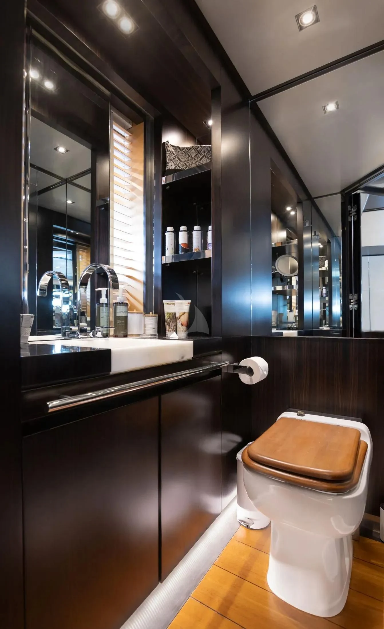 a bathroom with a toilet and a sink aboard MAC Yacht for Sale