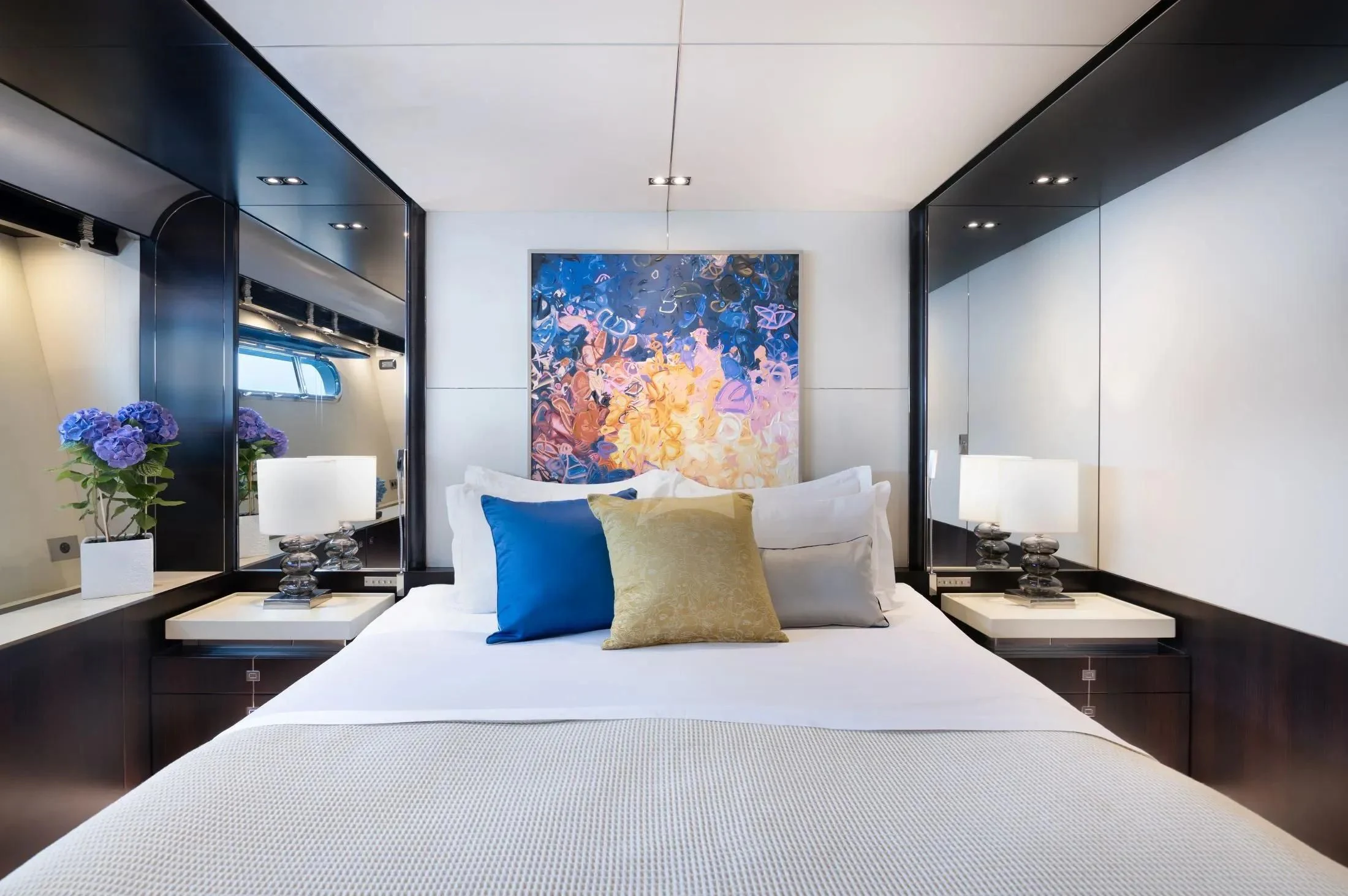 a bed with white sheets and pillows aboard MAC Yacht for Sale