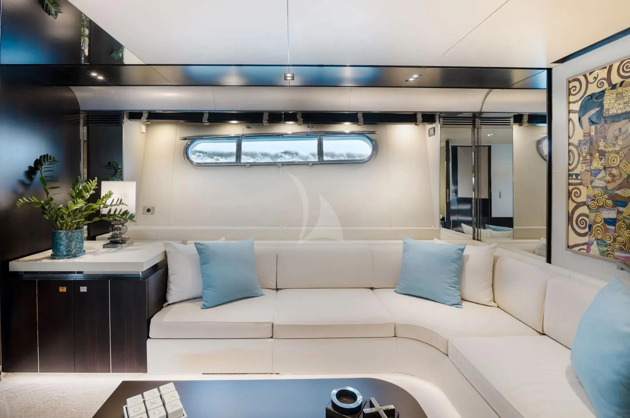 a white couch in a room aboard MAC Yacht for Sale