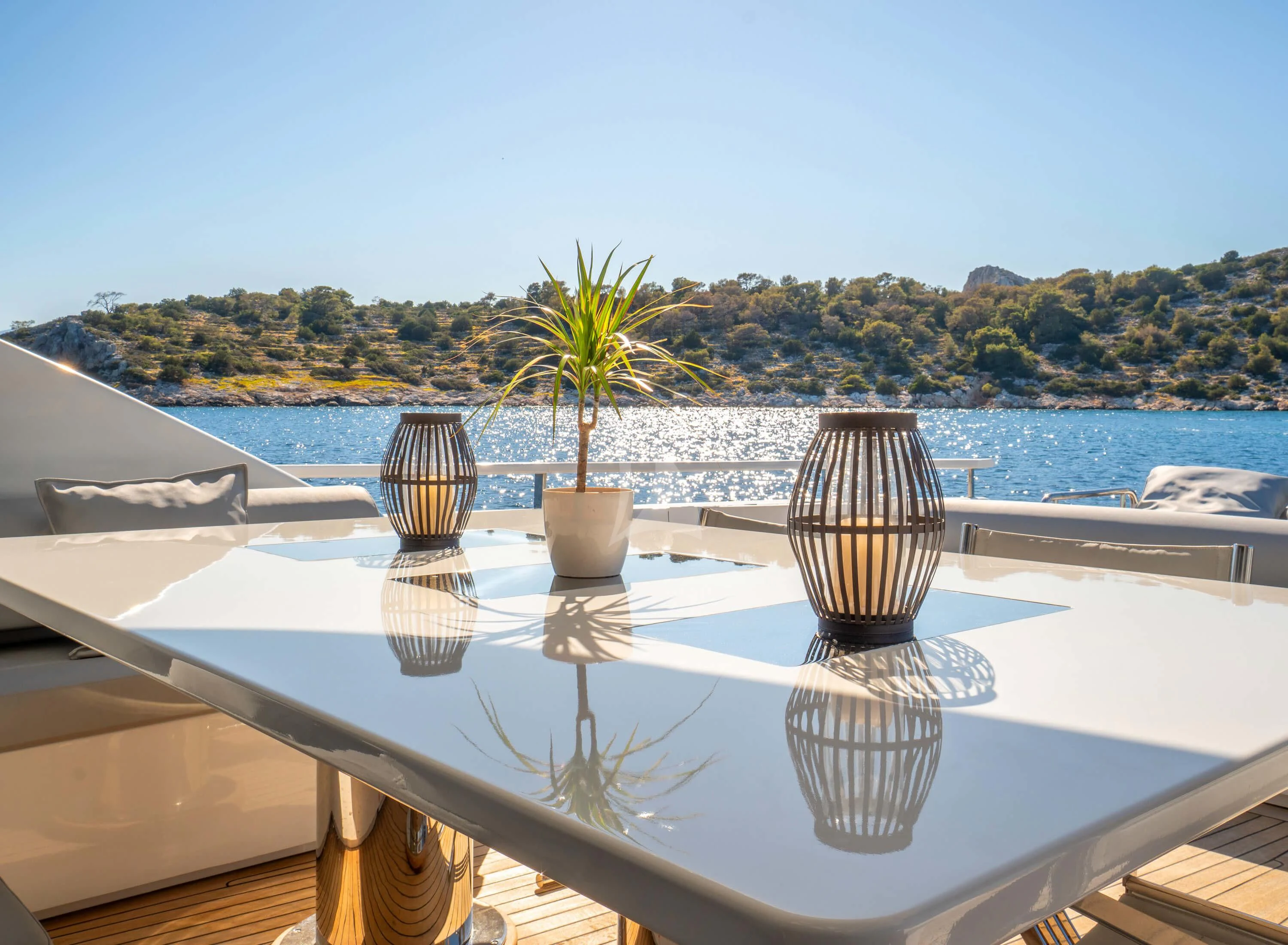 a table with vases on it aboard MAC Yacht for Sale