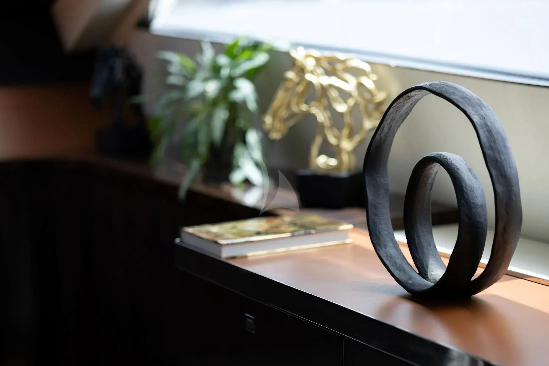 a black mug on a table aboard MAC Yacht for Sale