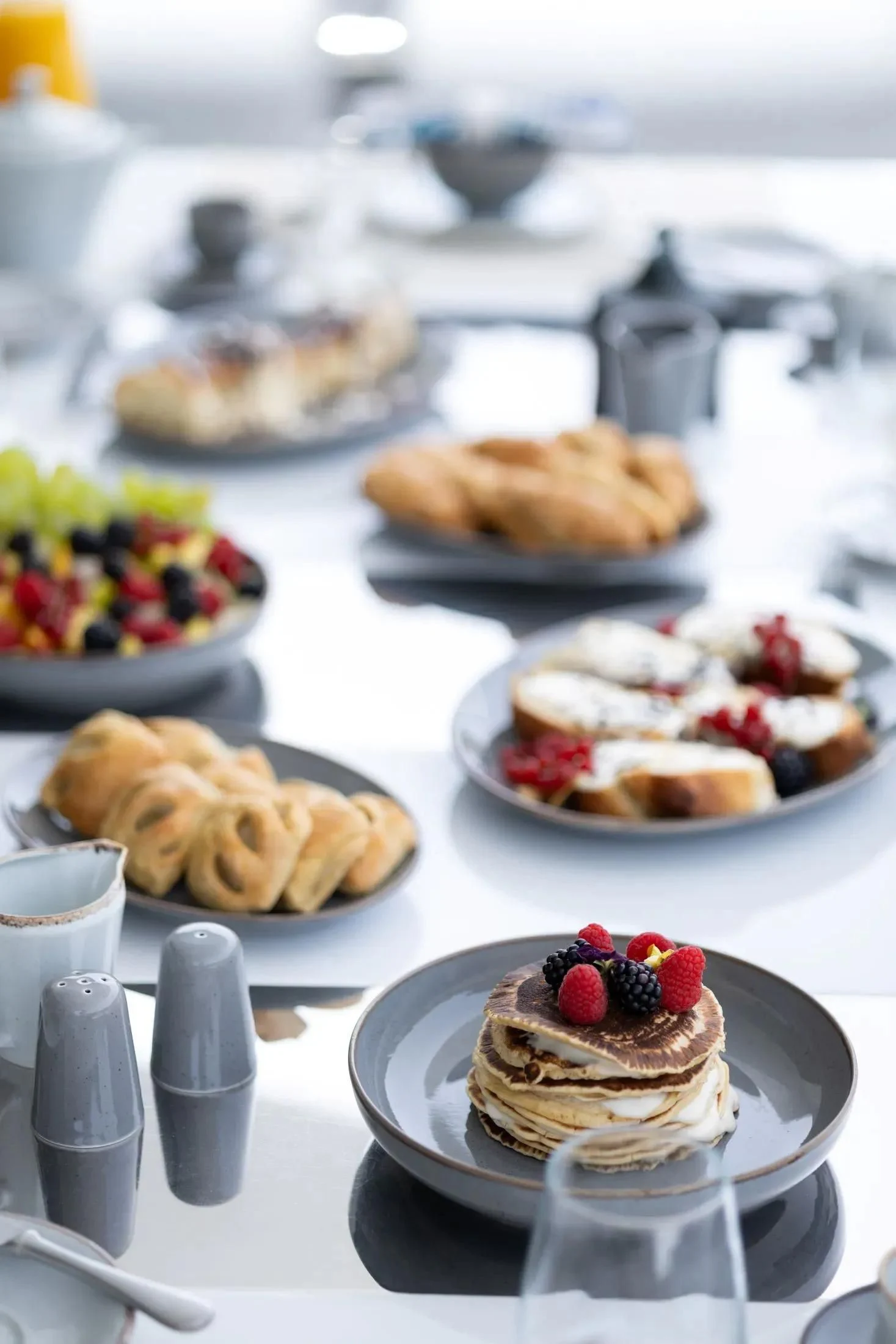 a table with desserts on it aboard MAC Yacht for Sale