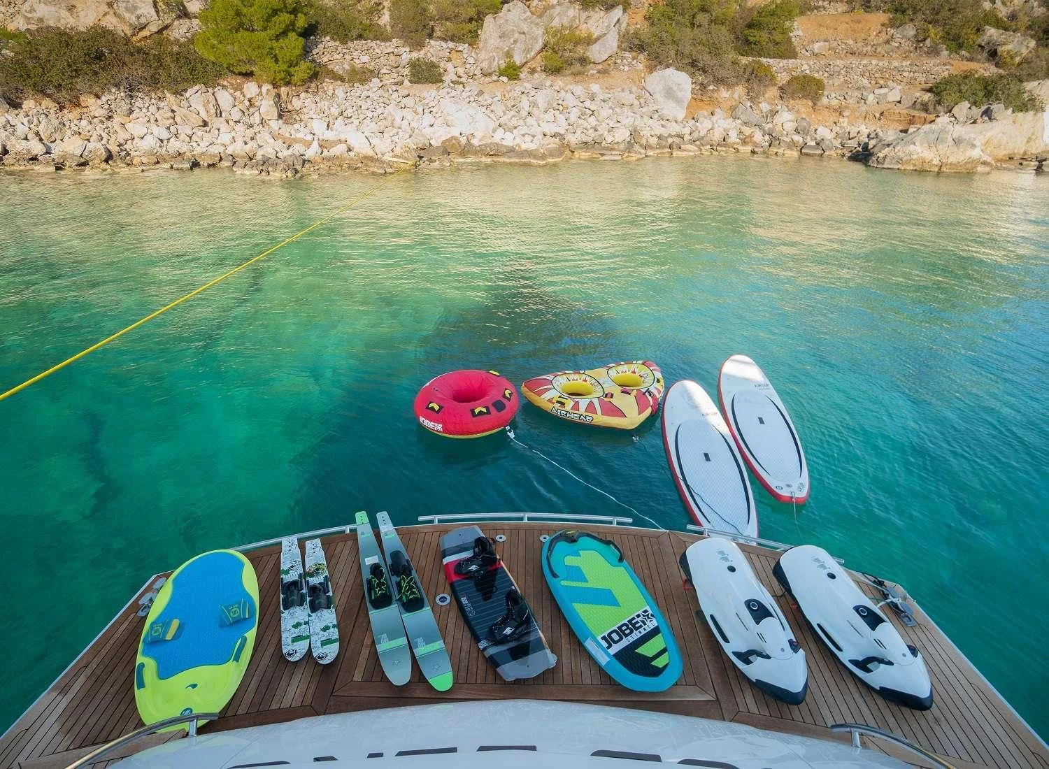 surfboards on a dock aboard MAC Yacht for Sale