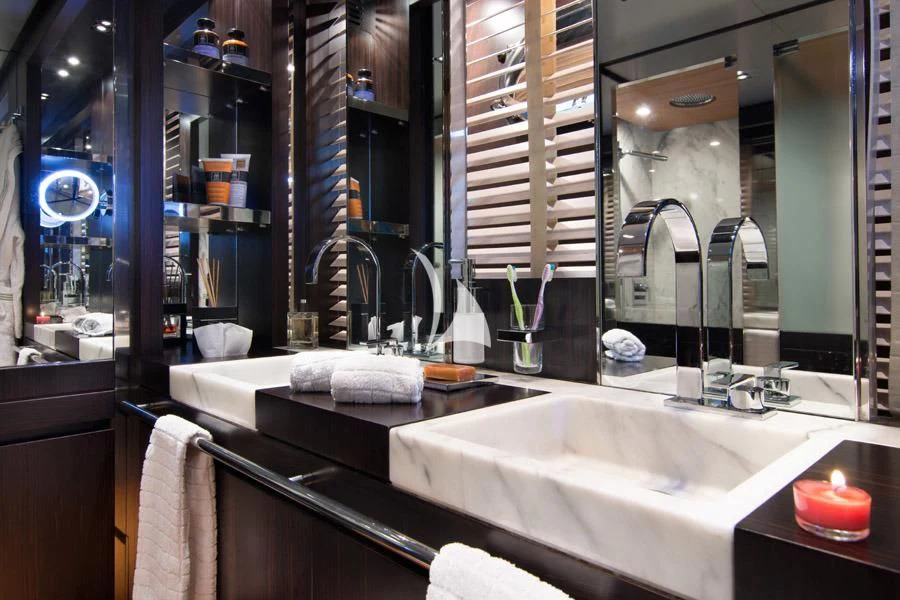 a bathroom with a large mirror aboard MAC Yacht for Sale