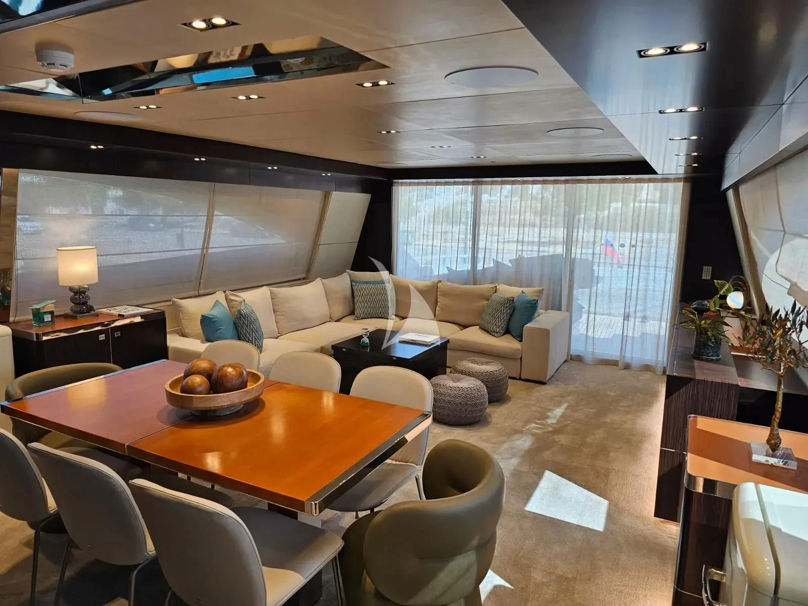 a living room with a couch and a table aboard MAC Yacht for Sale