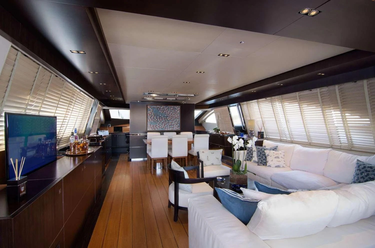 a room with a couch and a television aboard MAC Yacht for Sale