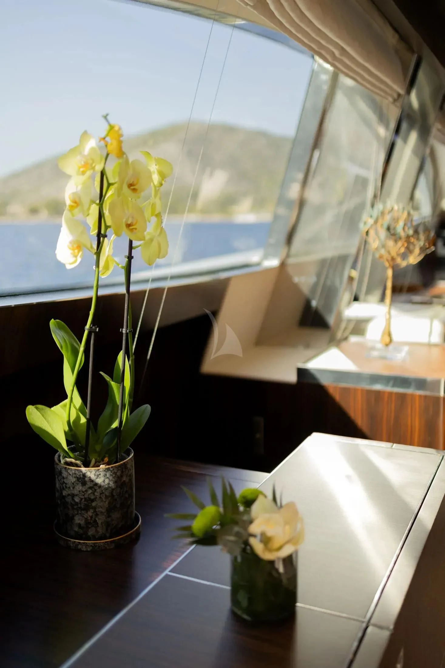 yellow flowers in a vase aboard MAC Yacht for Sale