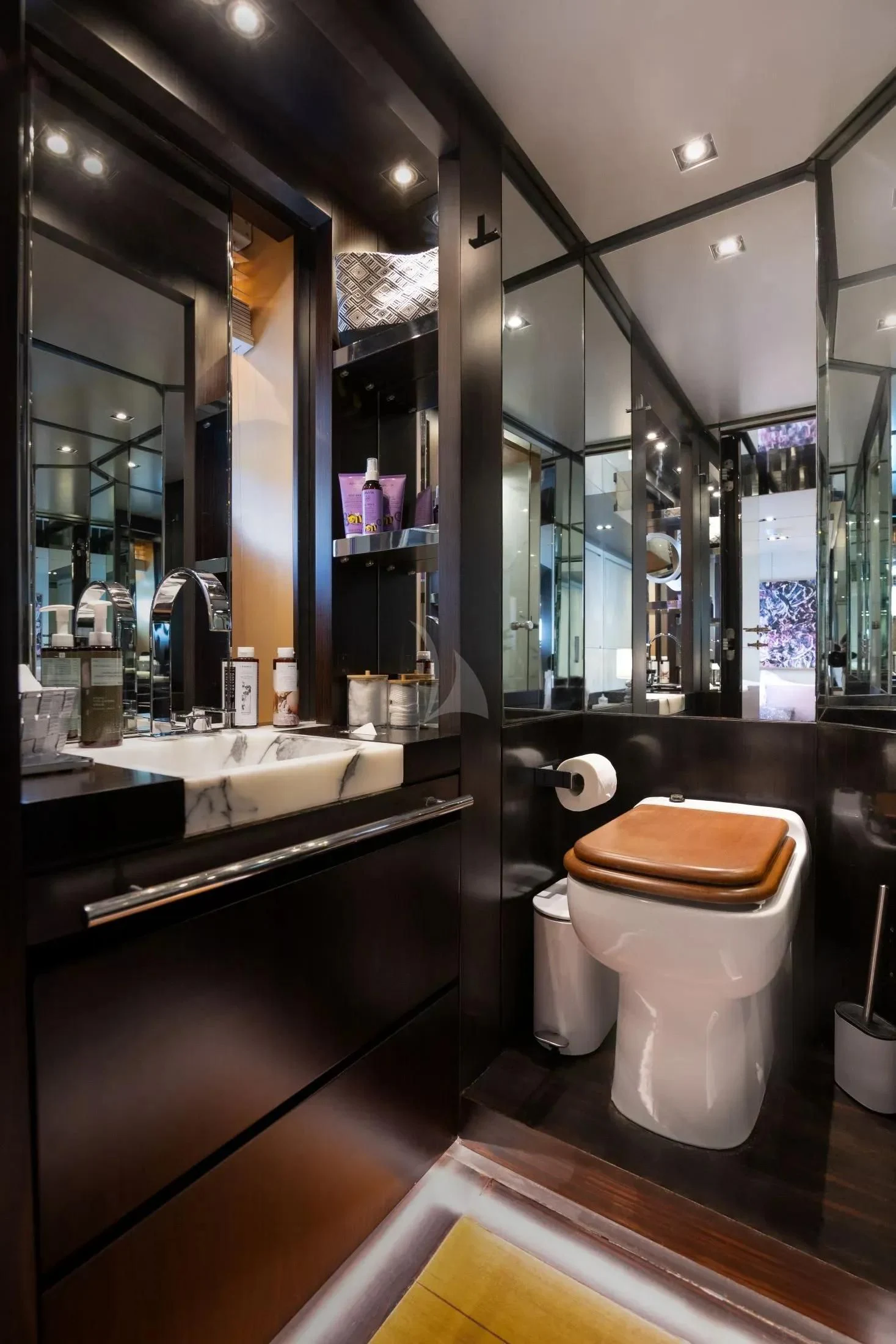 a bathroom with a toilet and sink aboard MAC Yacht for Sale