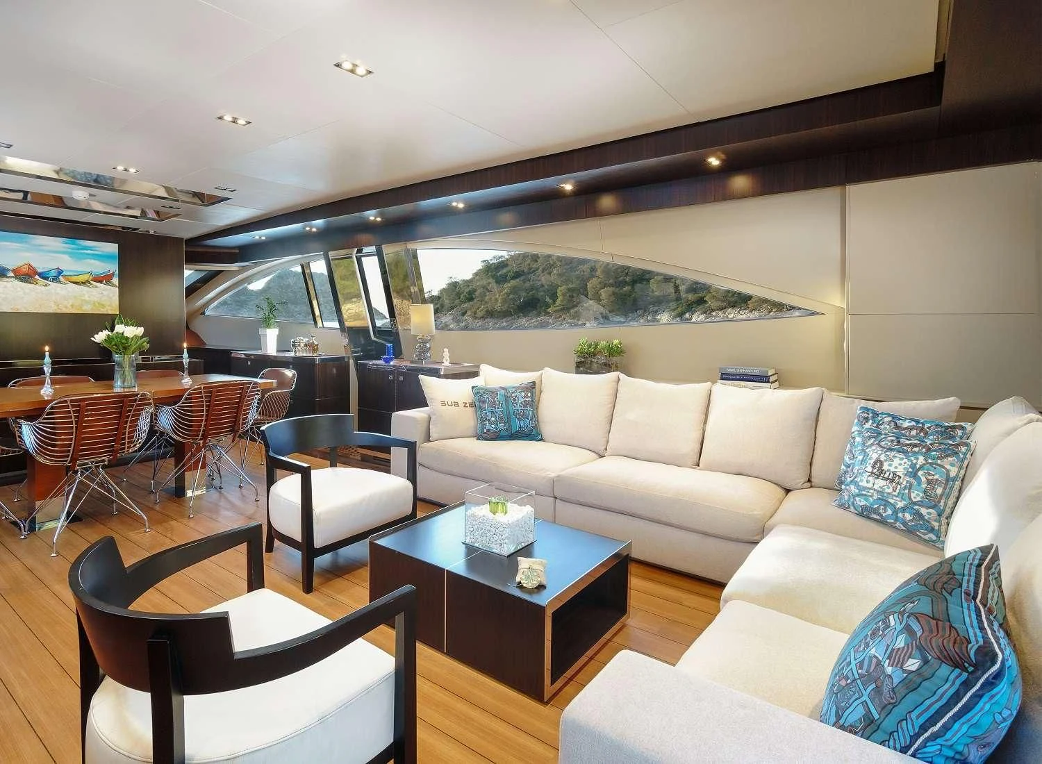 a living room with a couch and a table aboard MAC Yacht for Sale