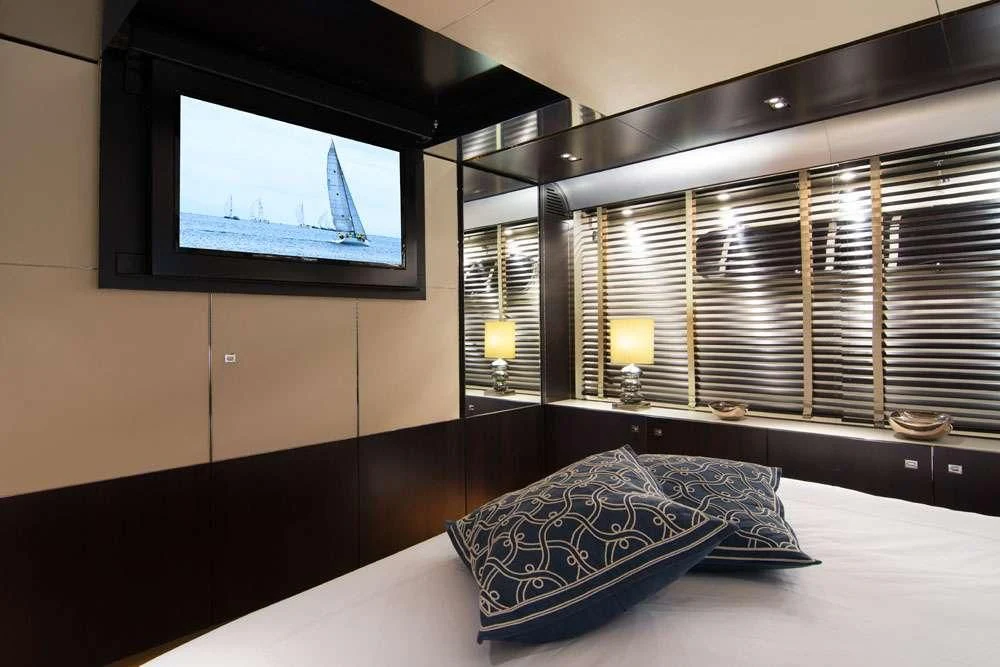a tv on a wall aboard MAC Yacht for Sale