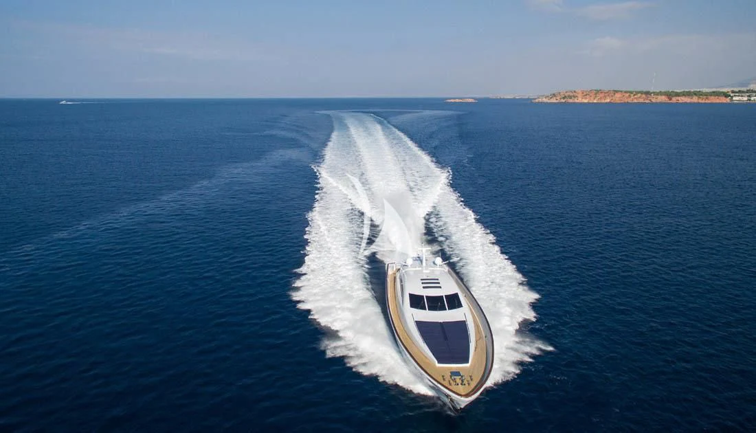 a speed boat on the water aboard MAC Yacht for Sale