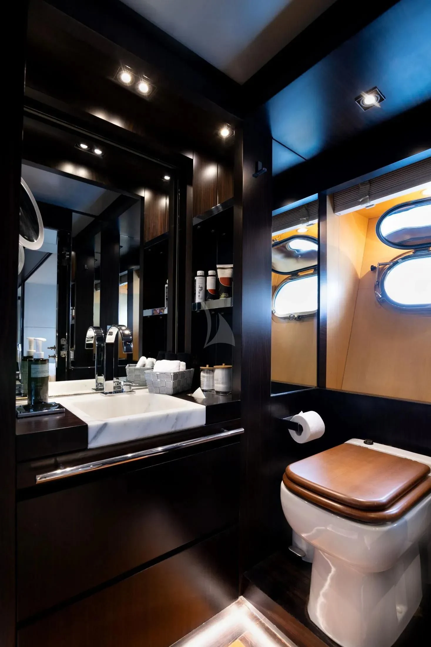 a bathroom with a large mirror aboard MAC Yacht for Sale