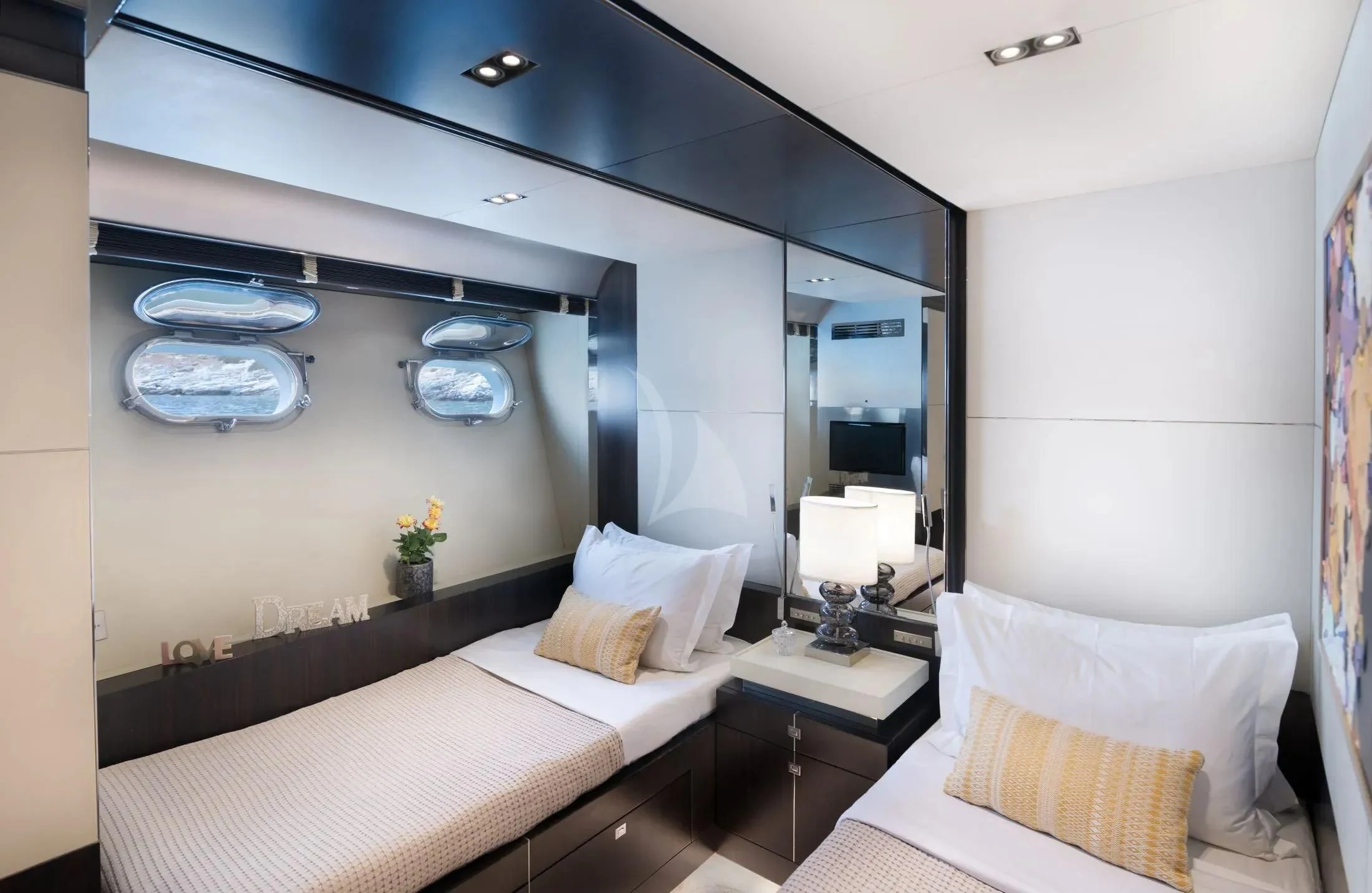 a room with a bed and a mirror aboard MAC Yacht for Sale