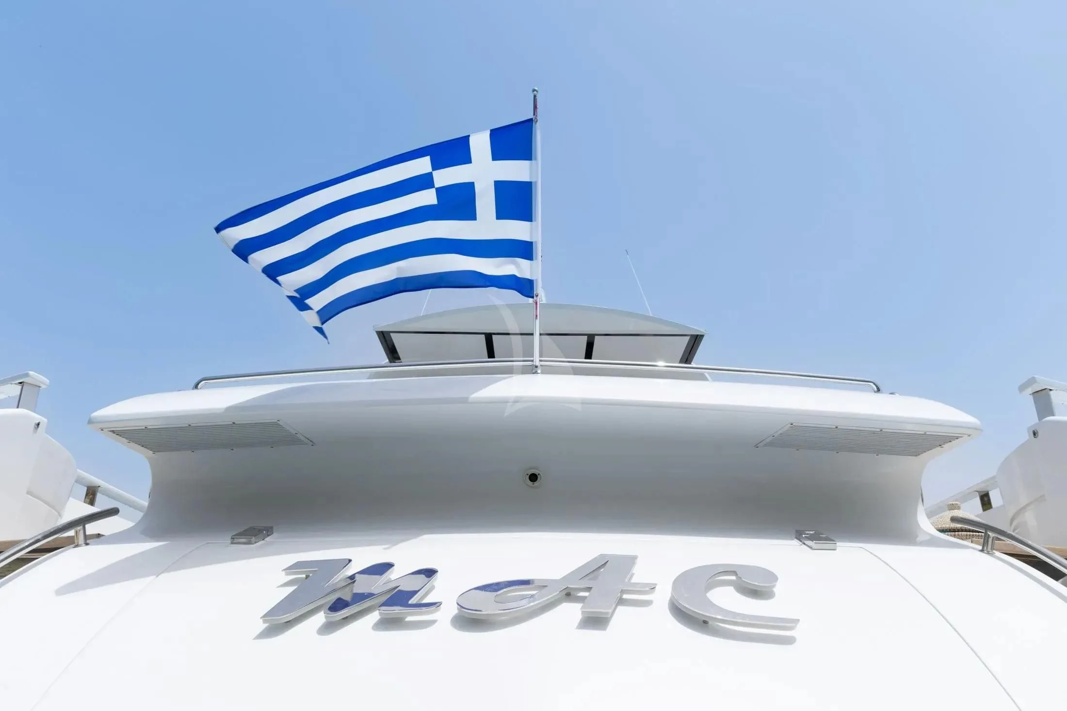 a white airplane with a blue flag aboard MAC Yacht for Sale