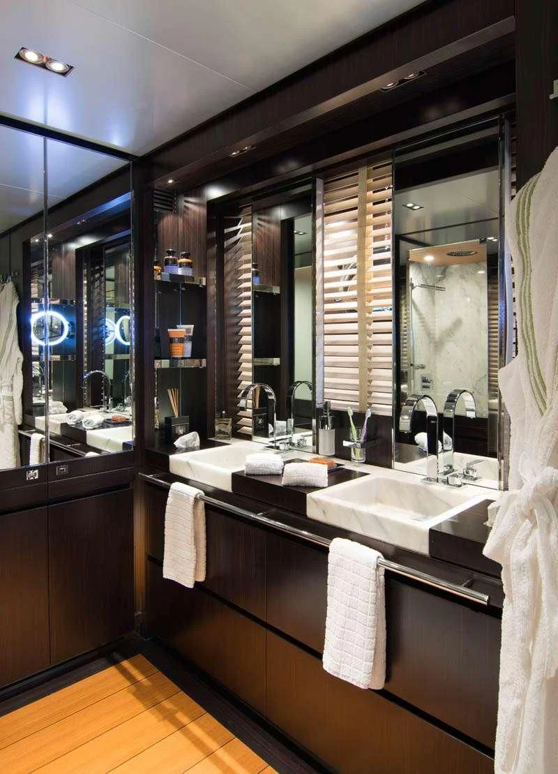 a bathroom with a large mirror aboard MAC Yacht for Sale