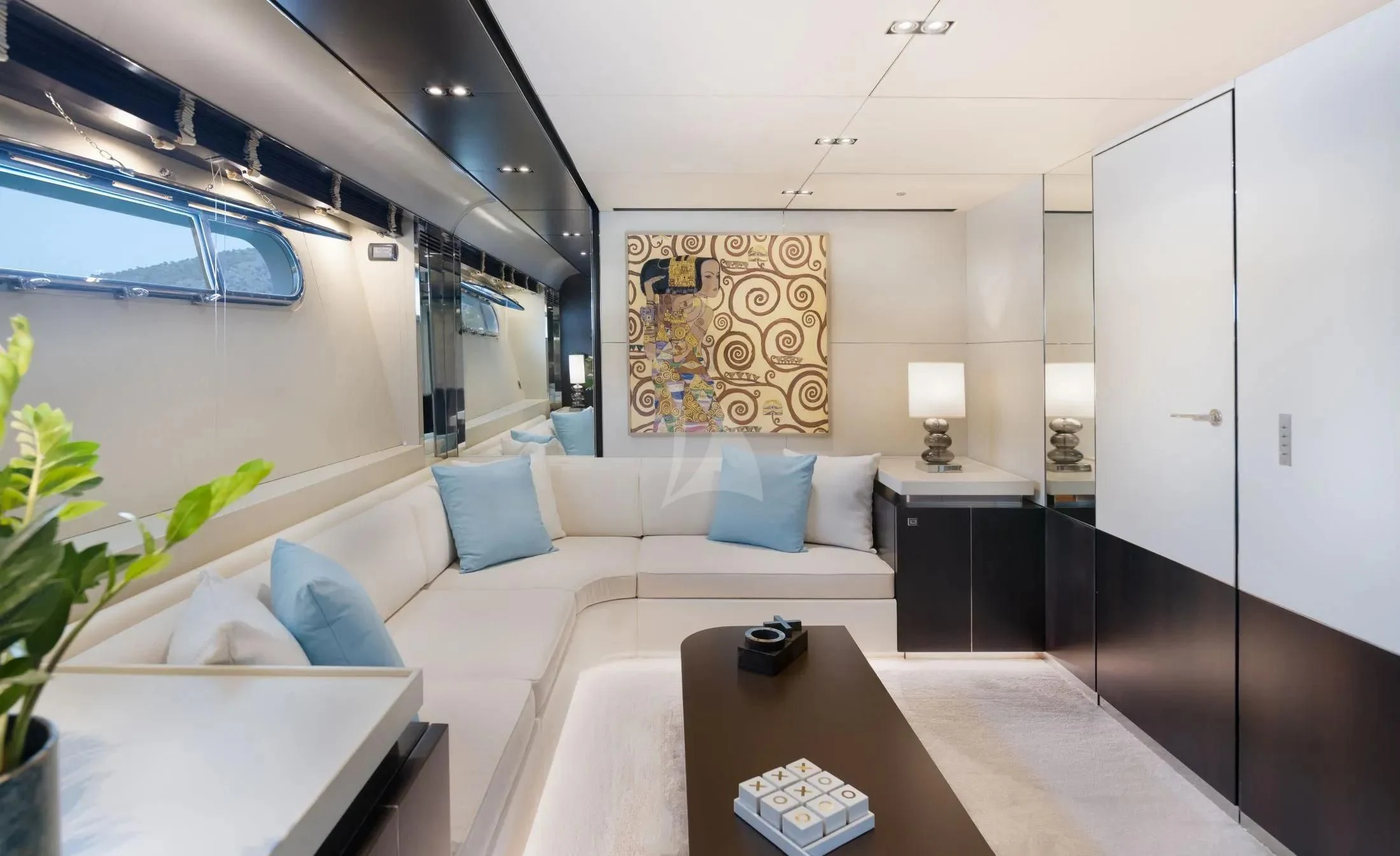 a living room with a couch and a coffee table aboard MAC Yacht for Sale