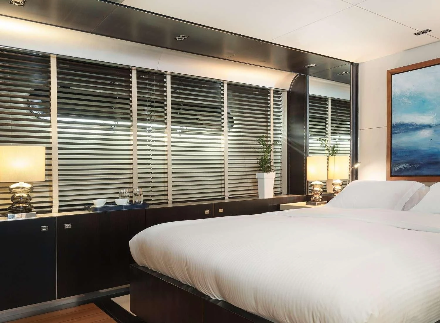 a bedroom with a large window aboard MAC Yacht for Sale