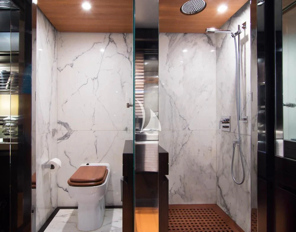 a bathroom with a toilet and shower aboard MAC Yacht for Sale