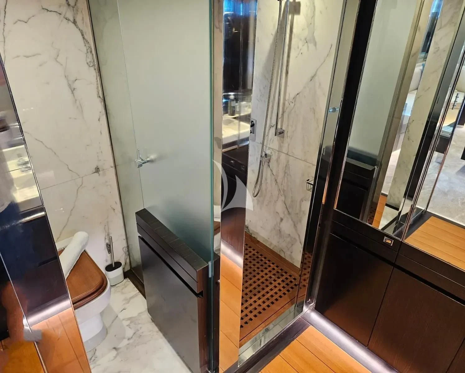 a hallway with glass doors aboard MAC Yacht for Sale
