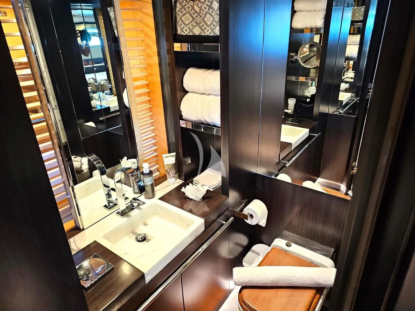 a bathroom with a large mirror aboard MAC Yacht for Sale