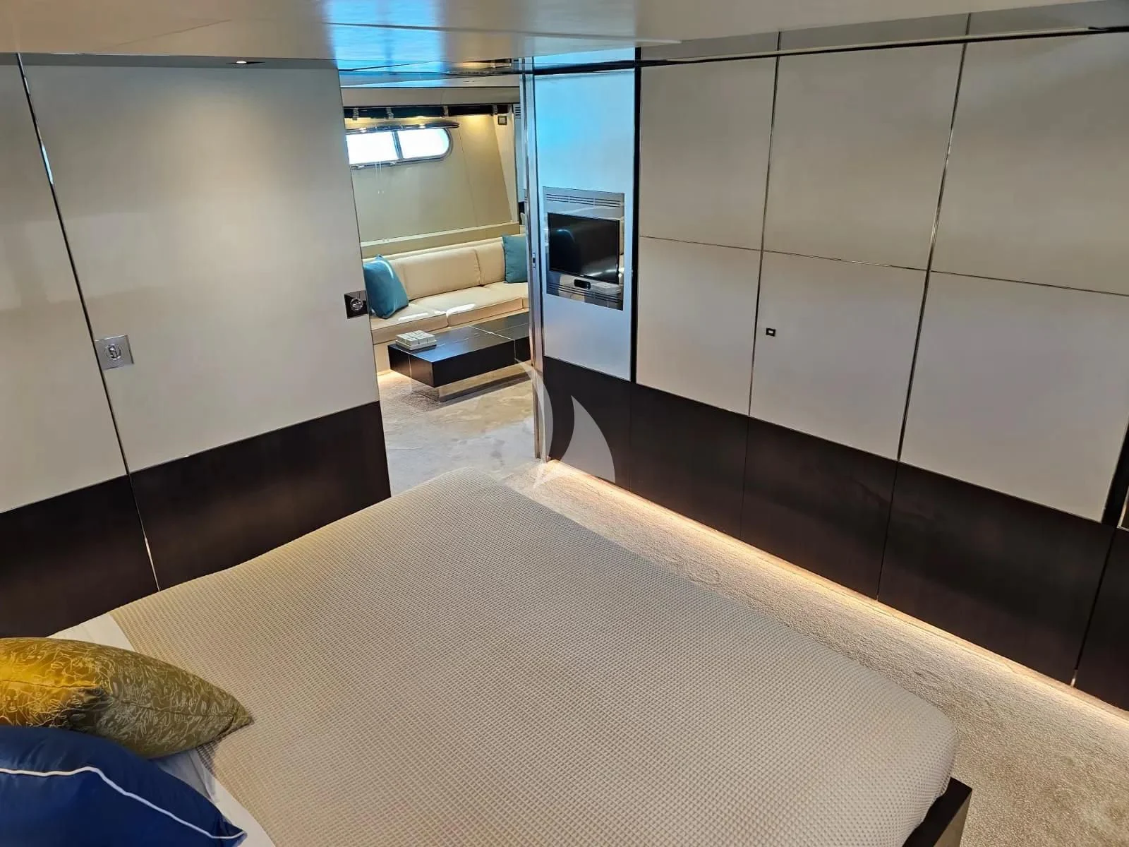 a room with a bed and a table aboard MAC Yacht for Sale