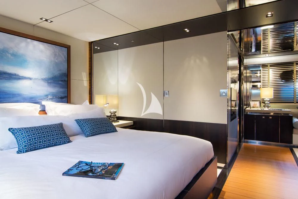 a bed with white sheets aboard MAC Yacht for Sale