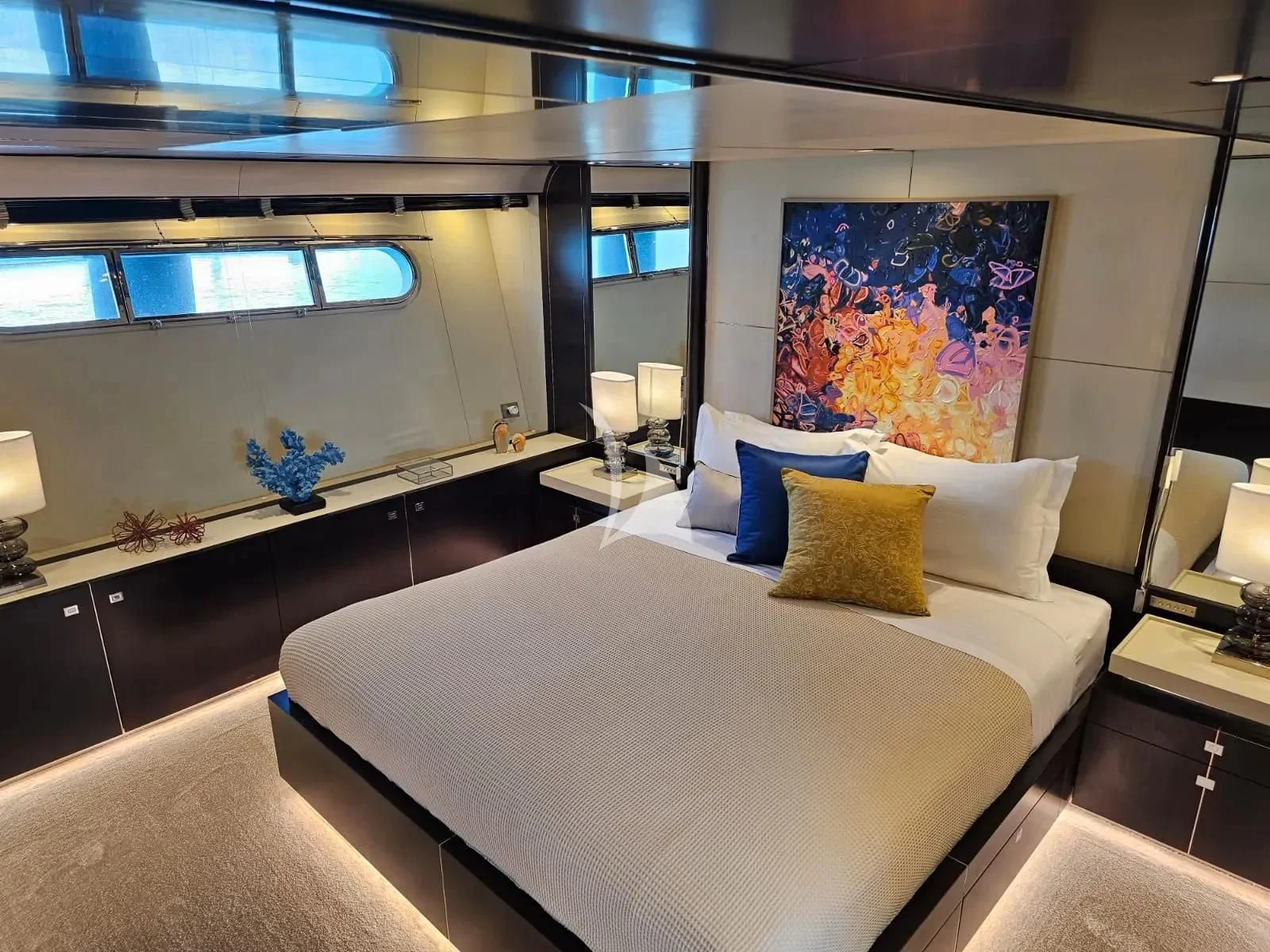 a large bed in a room aboard MAC Yacht for Sale
