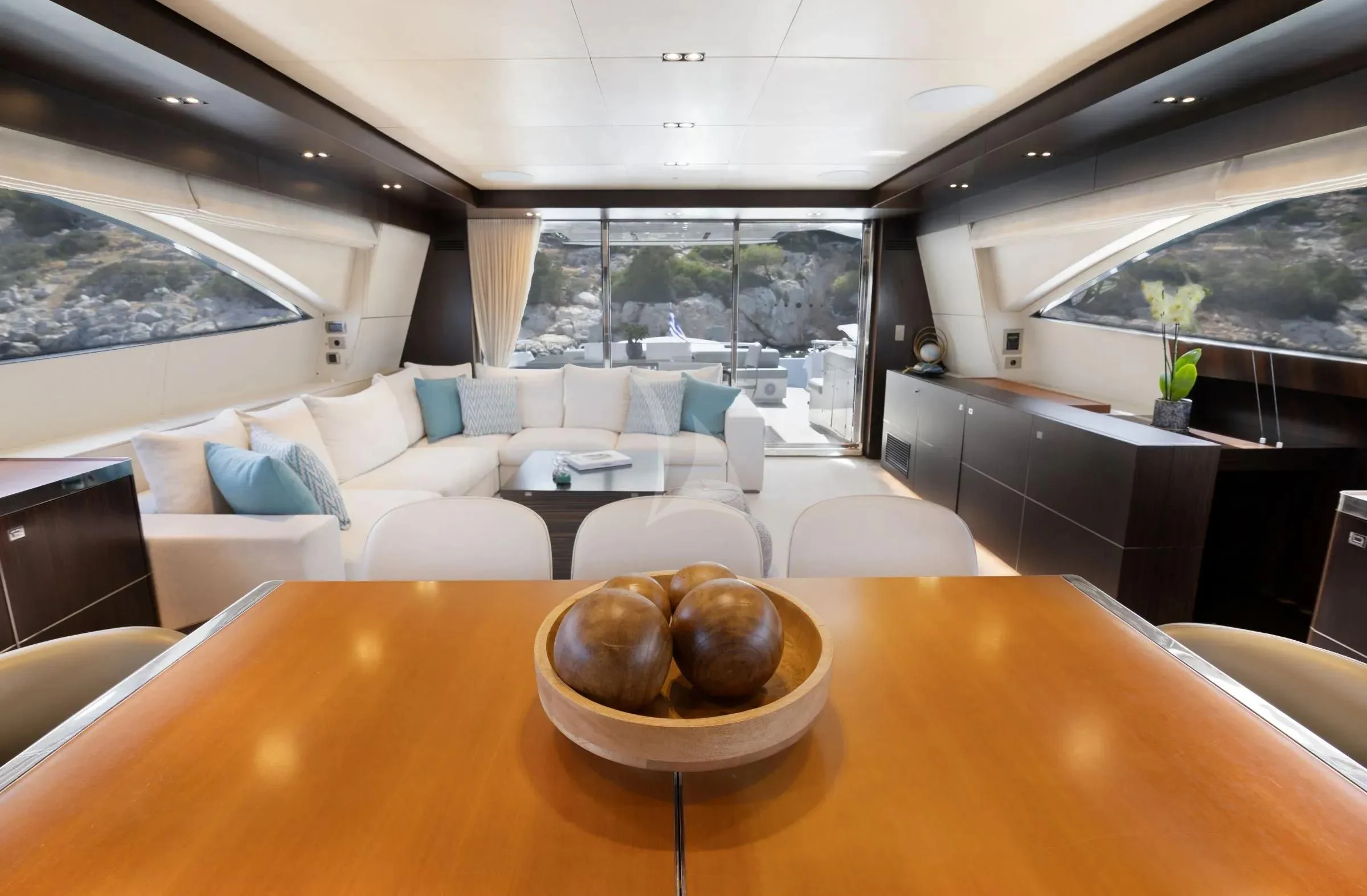 a room with a table and a plate of food aboard MAC Yacht for Sale