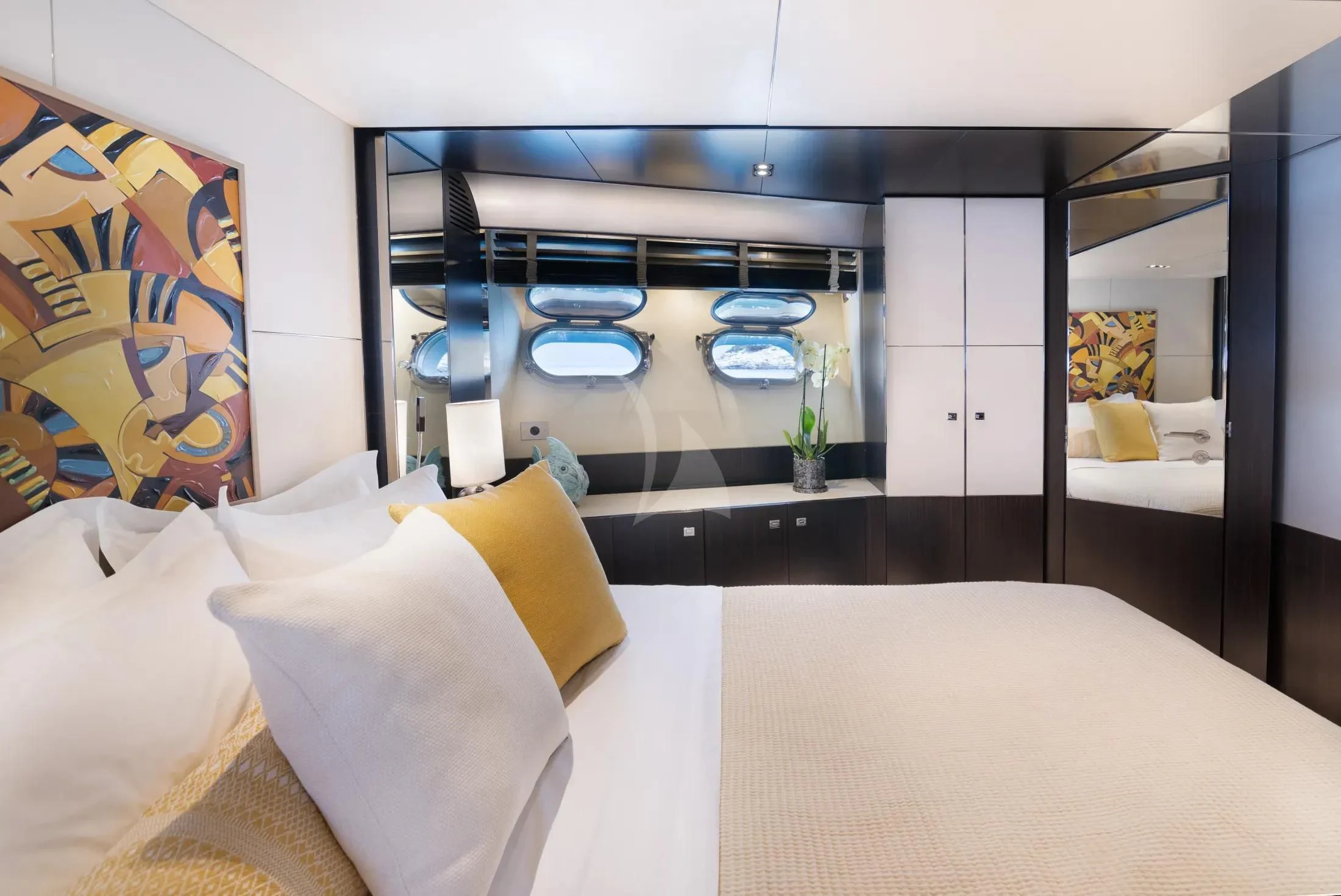 a room with a bed and a chair aboard MAC Yacht for Sale