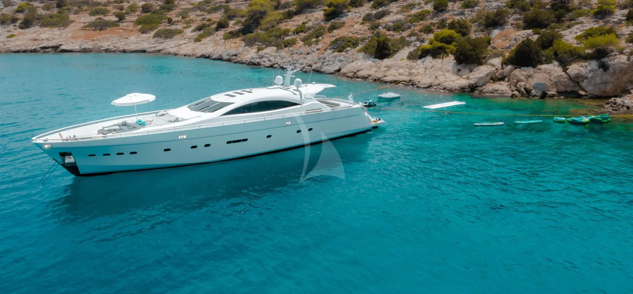 a white yacht in the water aboard MAC Yacht for Sale