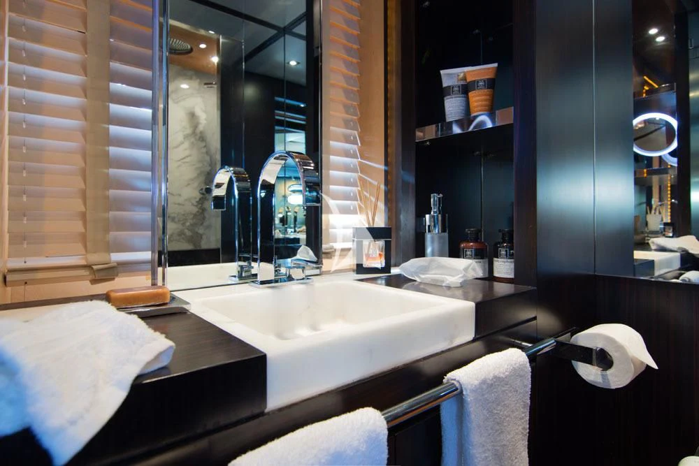 a bathroom with a large mirror aboard MAC Yacht for Sale