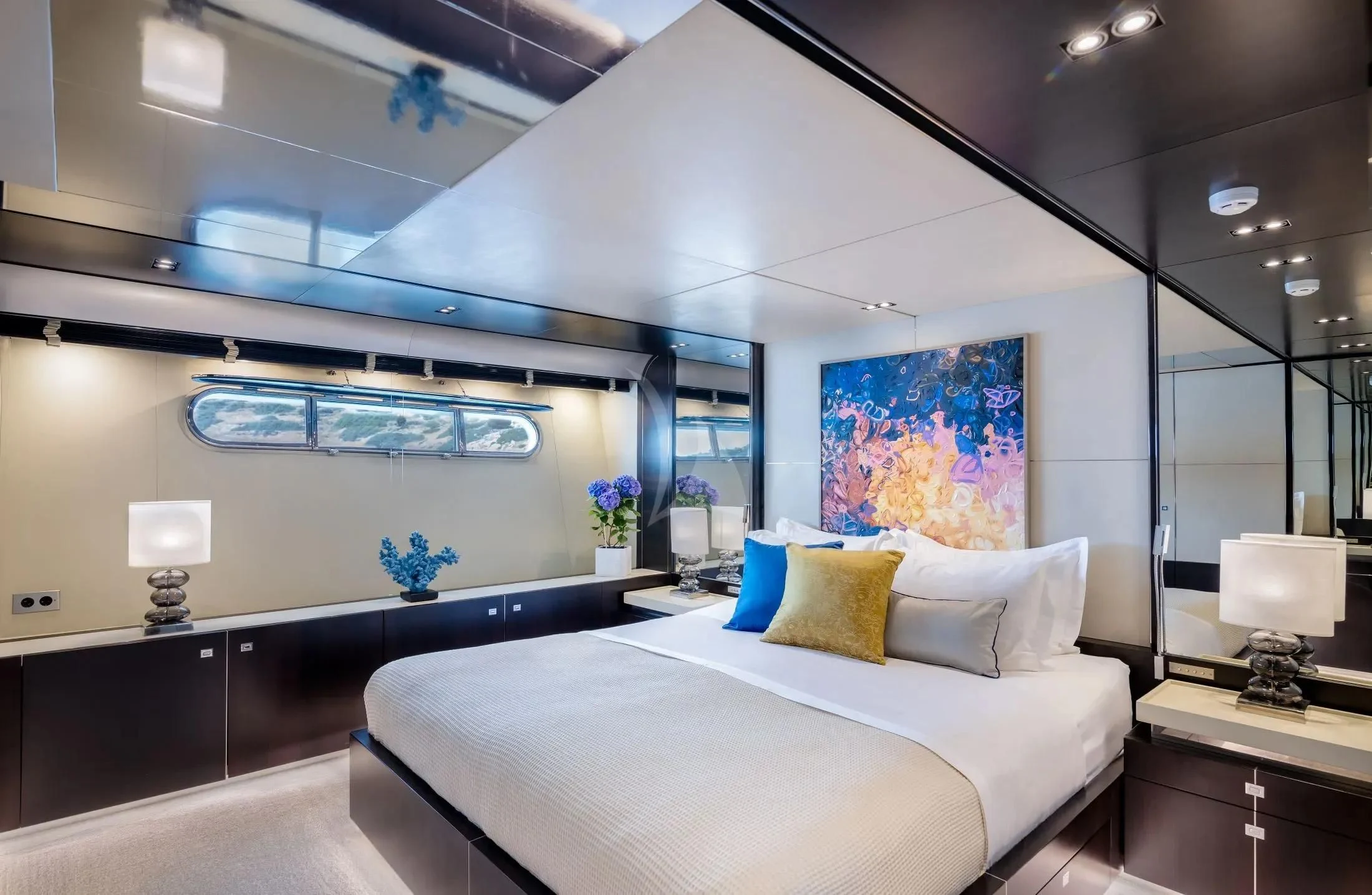a large bed in a room aboard MAC Yacht for Sale